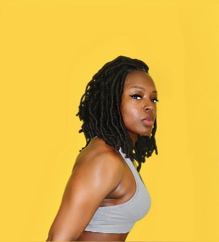 Linda Orji holding a dumbbell in her original fitness photoshoot
